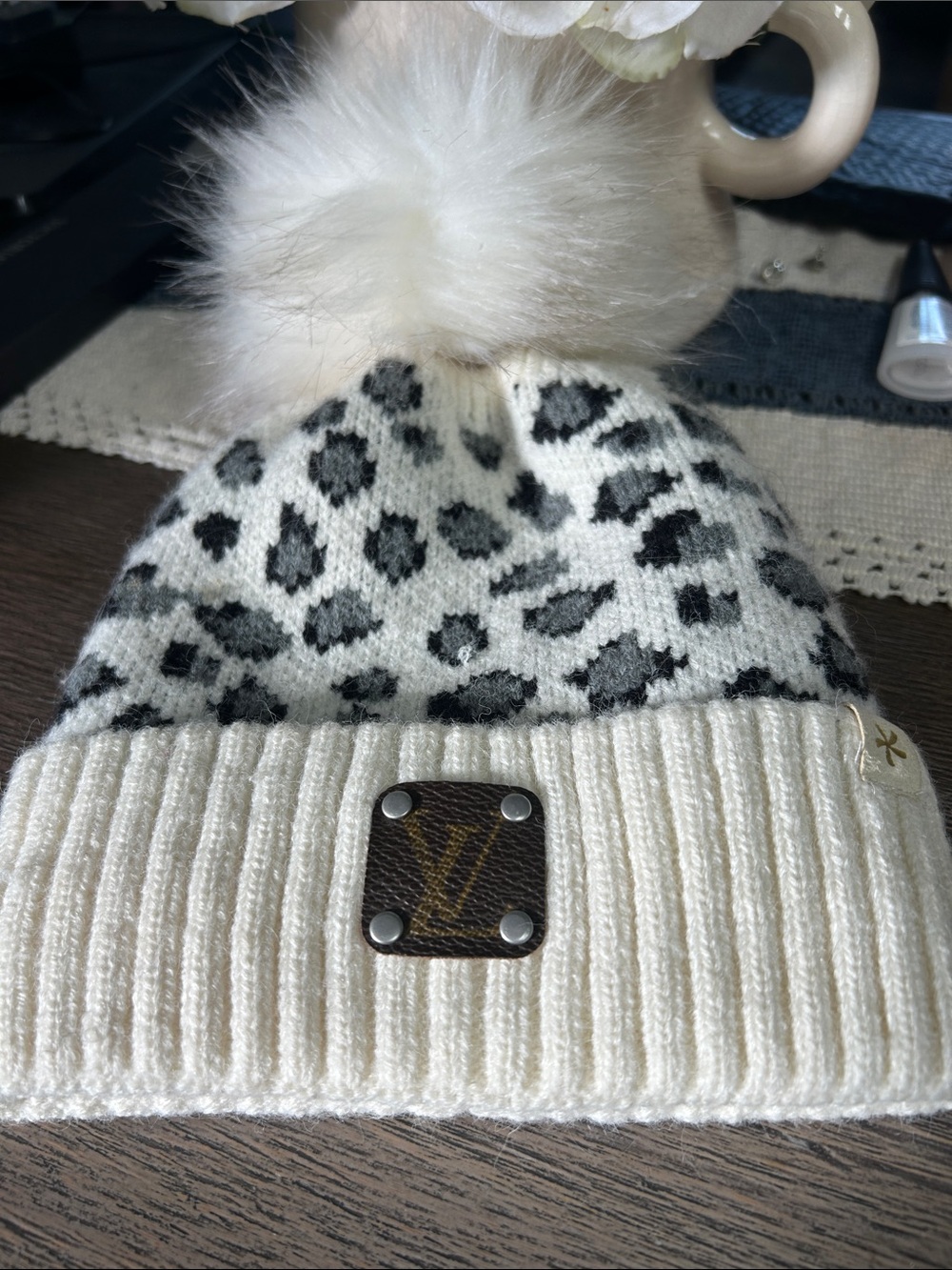 Cream Leopard Print Pom Pom Beanie with Designer Patch